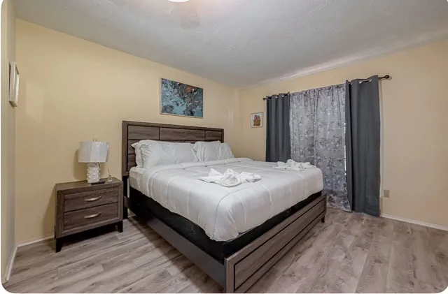 a bedroom with furniture and a chair