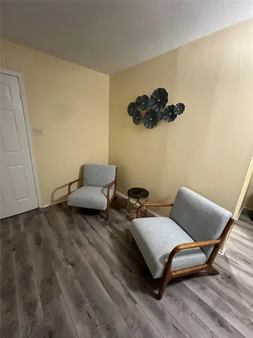 a bathroom with a granite countertop toilet sink and mirror