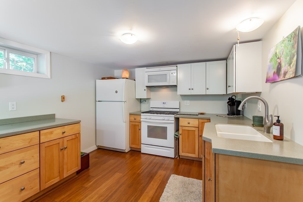 20 Nutting Road Groton, MA 01450 - Photo 21 of 28 a kitchen with granite countertop a sink stove and refrigerator
