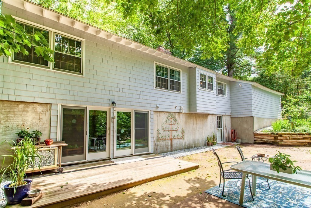 20 Nutting Road Groton, MA 01450 - Photo 25 of 28 a view of a house with backyard and sitting area
