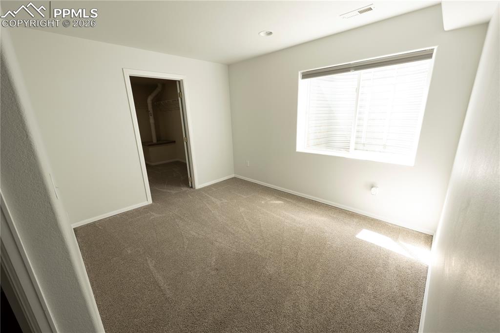 9212 Oakmont Road Peyton, CO 80831 - Photo 11 of 23 an empty room with windows