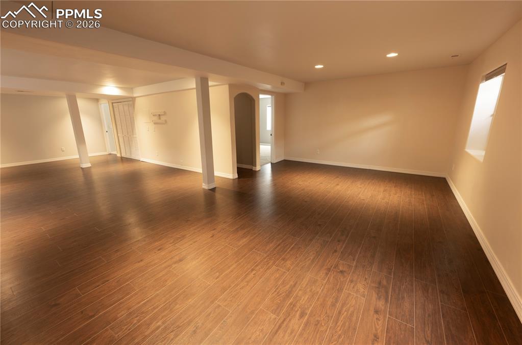 9212 Oakmont Road Peyton, CO 80831 - Photo 17 of 23 a view of an empty room with wooden floor and a window