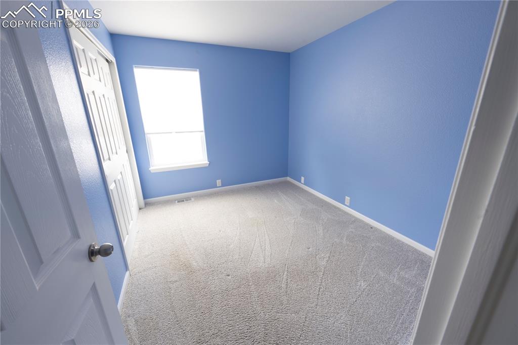 9212 Oakmont Road Peyton, CO 80831 - Photo 19 of 23 an empty room with windows