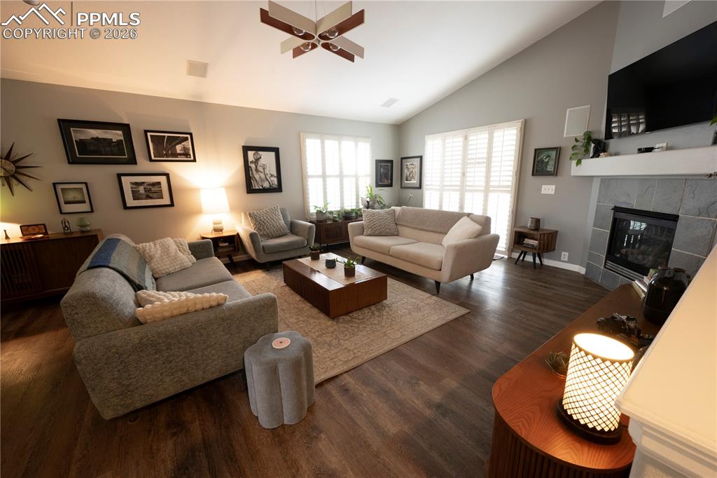 9212 Oakmont Road Peyton, CO 80831 - Photo 8 of 23 a living room with fireplace furniture and a flat screen tv