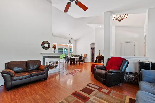 a kitchen with stainless steel appliances granite countertop a stove top oven a refrigerator and a sink