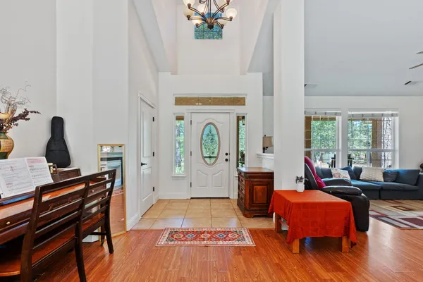 a dining room with furniture window and wooden floor