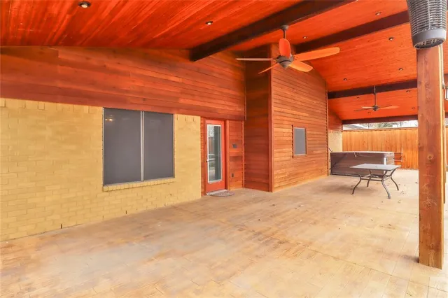 a view of backyard with a table and chairs