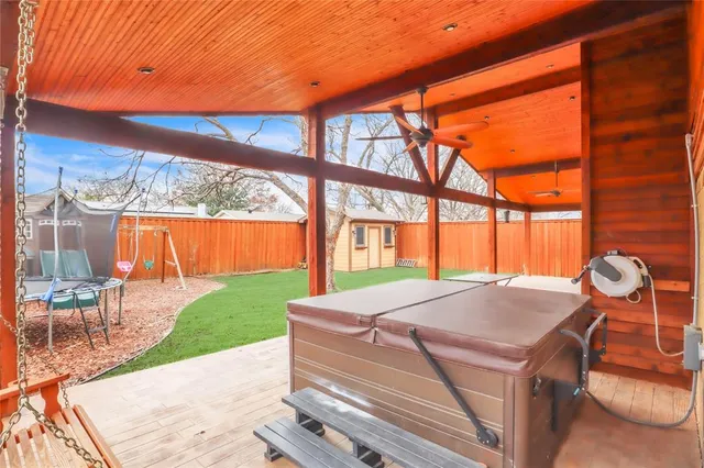a view of backyard with a table and chairs