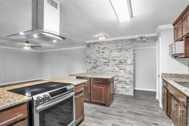 a kitchen with a stove and a sink