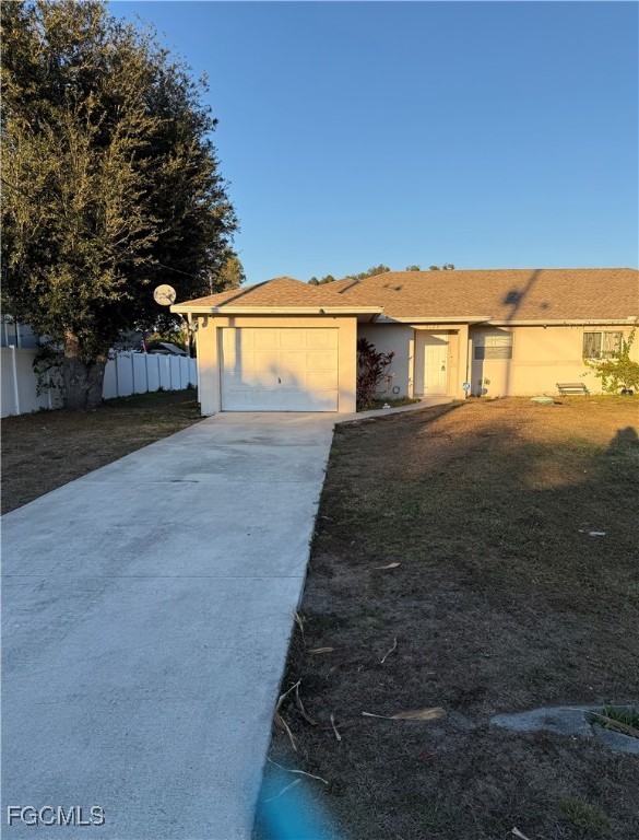 5130 26th Street Southwest Lehigh Acres, FL 33973 - Photo 1 of 10 a view of a house with a yard