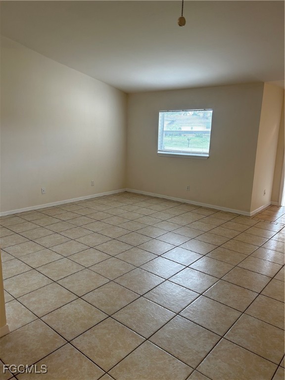 5130 26th Street Southwest Lehigh Acres, FL 33973 - Photo 4 of 10 a view of an empty room and a window