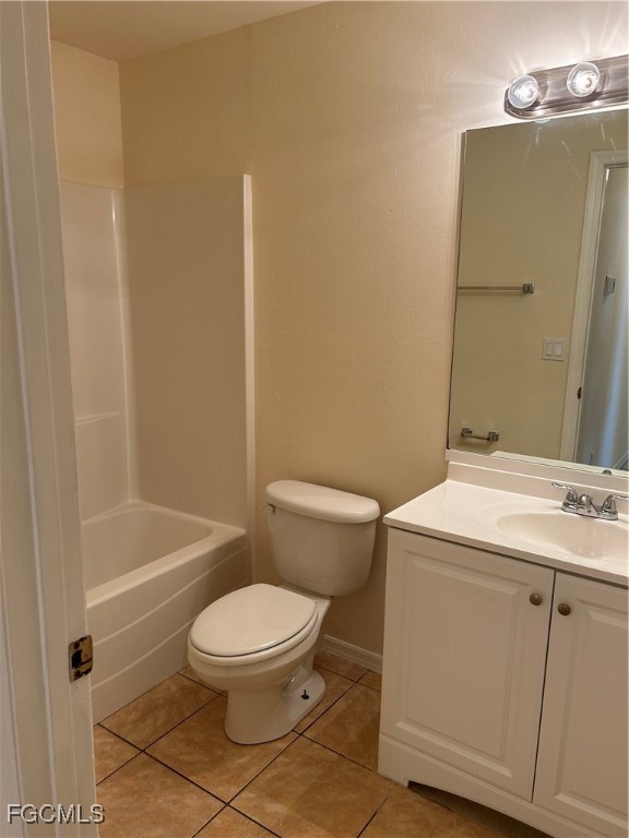 5130 26th Street Southwest Lehigh Acres, FL 33973 - Photo 6 of 10 a bathroom with a toilet a sink and bathtub