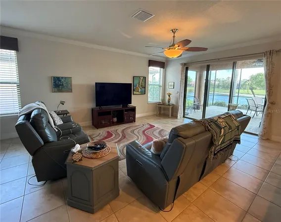 a kitchen with a refrigerator and a dining table