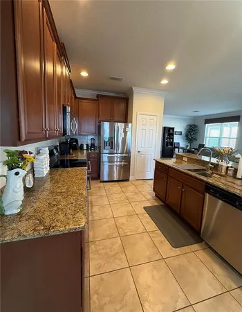a view of a livingroom with workspace and a window