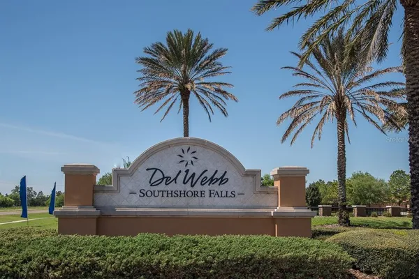a living room with furniture and a swimming pool
