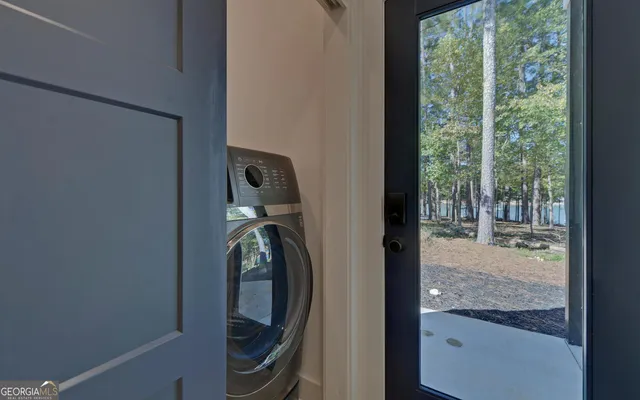 a spacious bathroom with a double vanity sink and a mirror