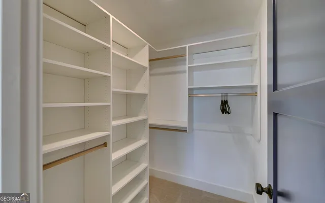a kitchen with a refrigerator sink and windows