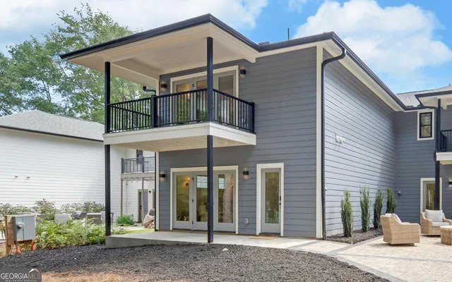a bedroom with a bed and a table