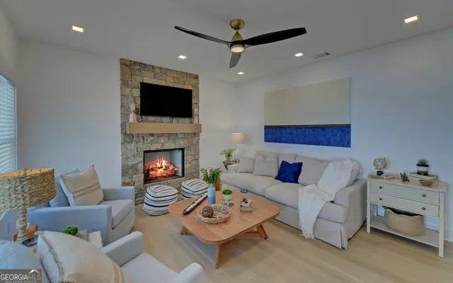 a living room with furniture and a fireplace