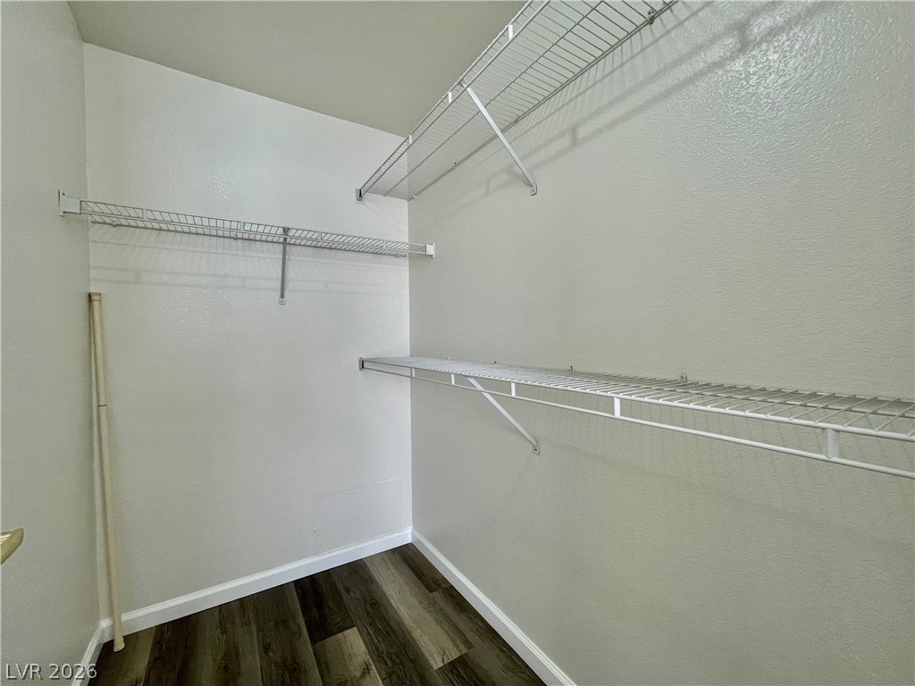 555 East Silverado Ranch Boulevard, Unit 1014 Las Vegas, NV 89183 - Photo 11 of 18 This ample walk-in closet features convenient shelving, offering practical storage solutions for any wardrobe.