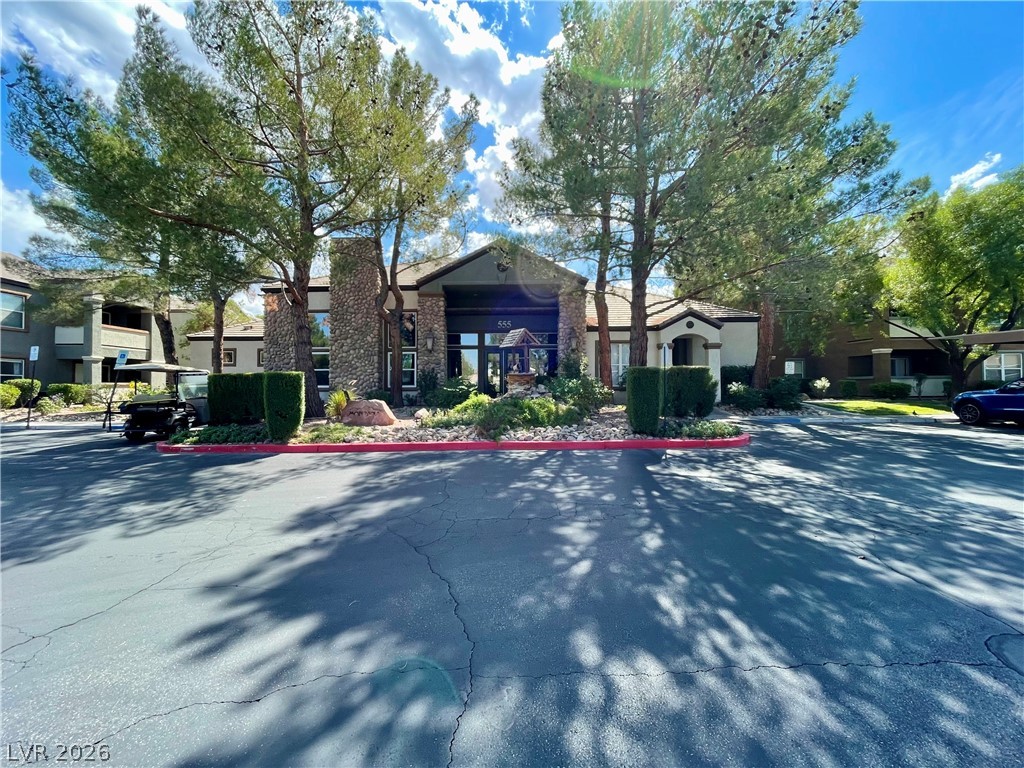 555 East Silverado Ranch Boulevard, Unit 1014 Las Vegas, NV 89183 - Photo 15 of 18 The welcoming entrance to this building offers a blend of natural elements and architectural design.