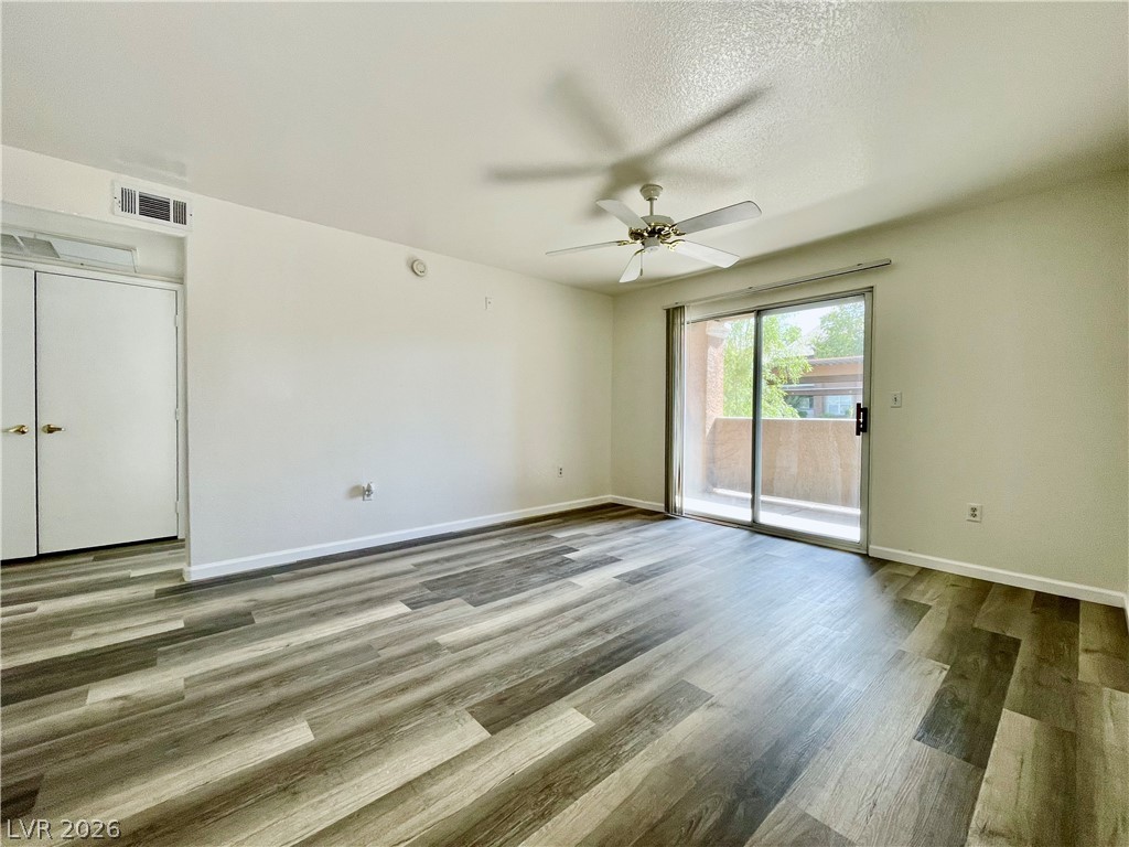 555 East Silverado Ranch Boulevard, Unit 1014 Las Vegas, NV 89183 - Photo 3 of 18 This living area features ample natural light and durable flooring, perfect for comfortable living.