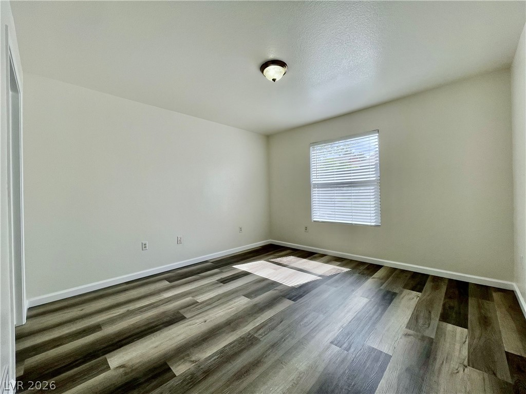 555 East Silverado Ranch Boulevard, Unit 1014 Las Vegas, NV 89183 - Photo 9 of 18 This bright room features a clean design with modern flooring and abundant natural light.