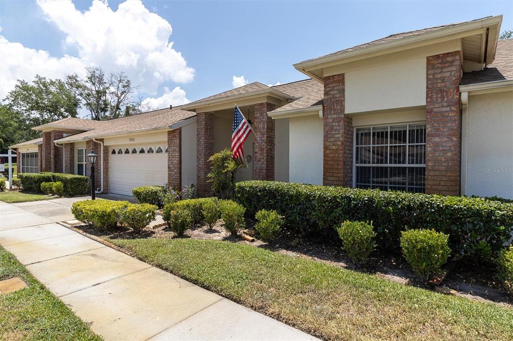 9052 Arundle Place New Port Richey, FL 34655 - Photo 28 of 57 a front view of a house with a yard