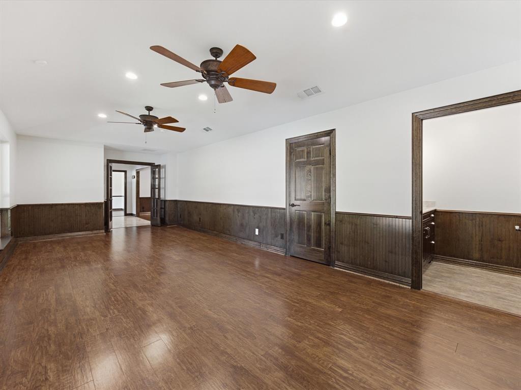 3717 Myrtle Springs Road Benbrook, TX 76116 - Photo 33 of 40 Den looking into the entryway of the home. Note the doors can be closed for privacy if needed and to the right of this pic is the powder room