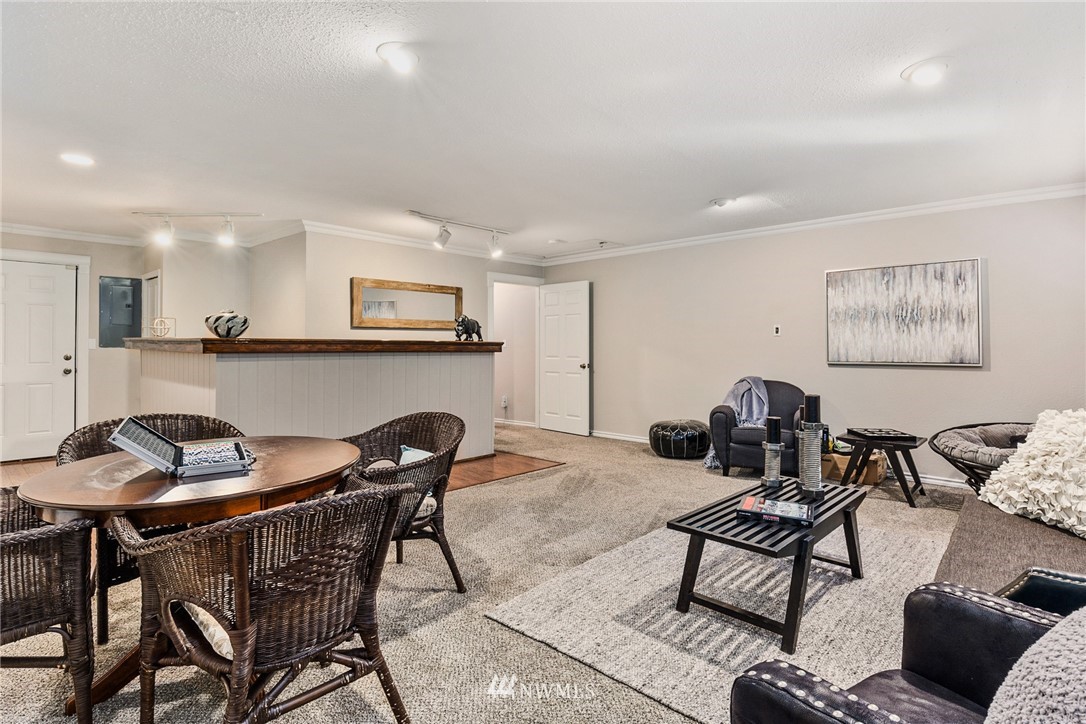 5405 156th Street Southwest Edmonds, WA 98026 - Photo 19 of 27 a living room with furniture and a kitchen island