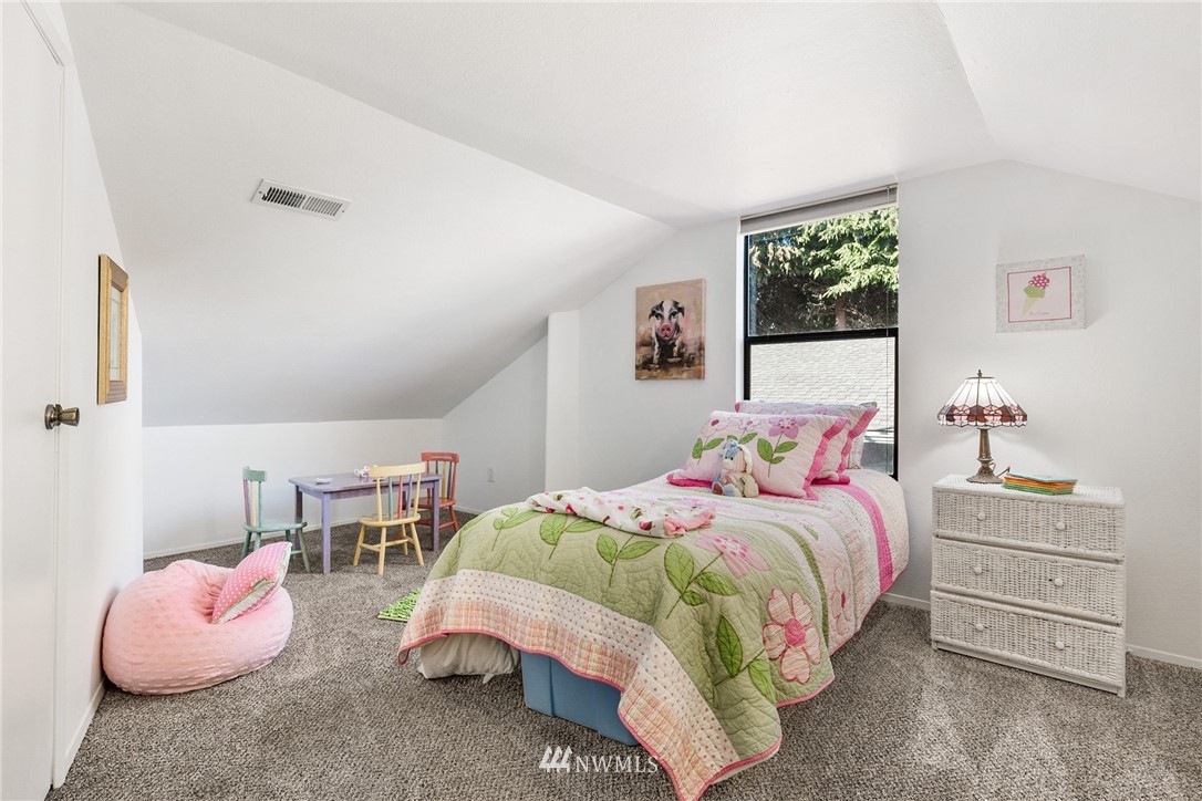 5405 156th Street Southwest Edmonds, WA 98026 - Photo 21 of 27 a bedroom with a bed and a window