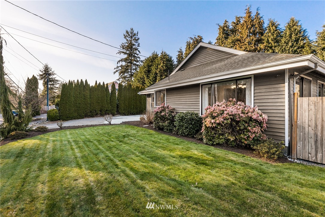 5405 156th Street Southwest Edmonds, WA 98026 - Photo 27 of 27 a view of a house with yard and a garden