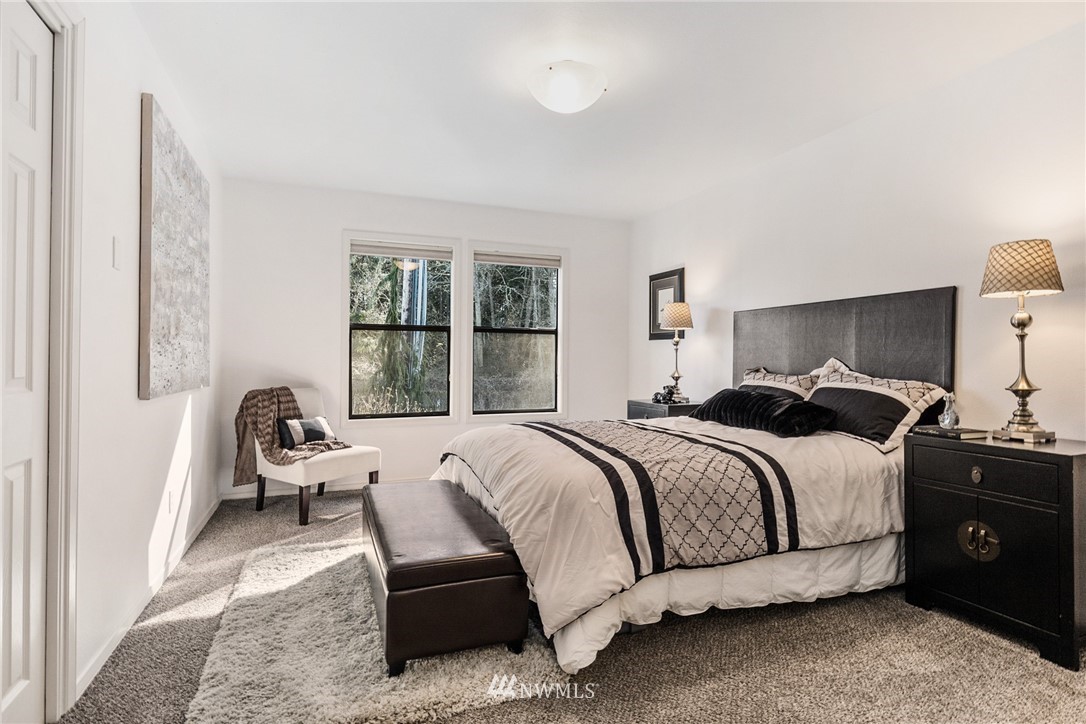 5405 156th Street Southwest Edmonds, WA 98026 - Photo 5 of 27 a bed room with a bed and a chair
