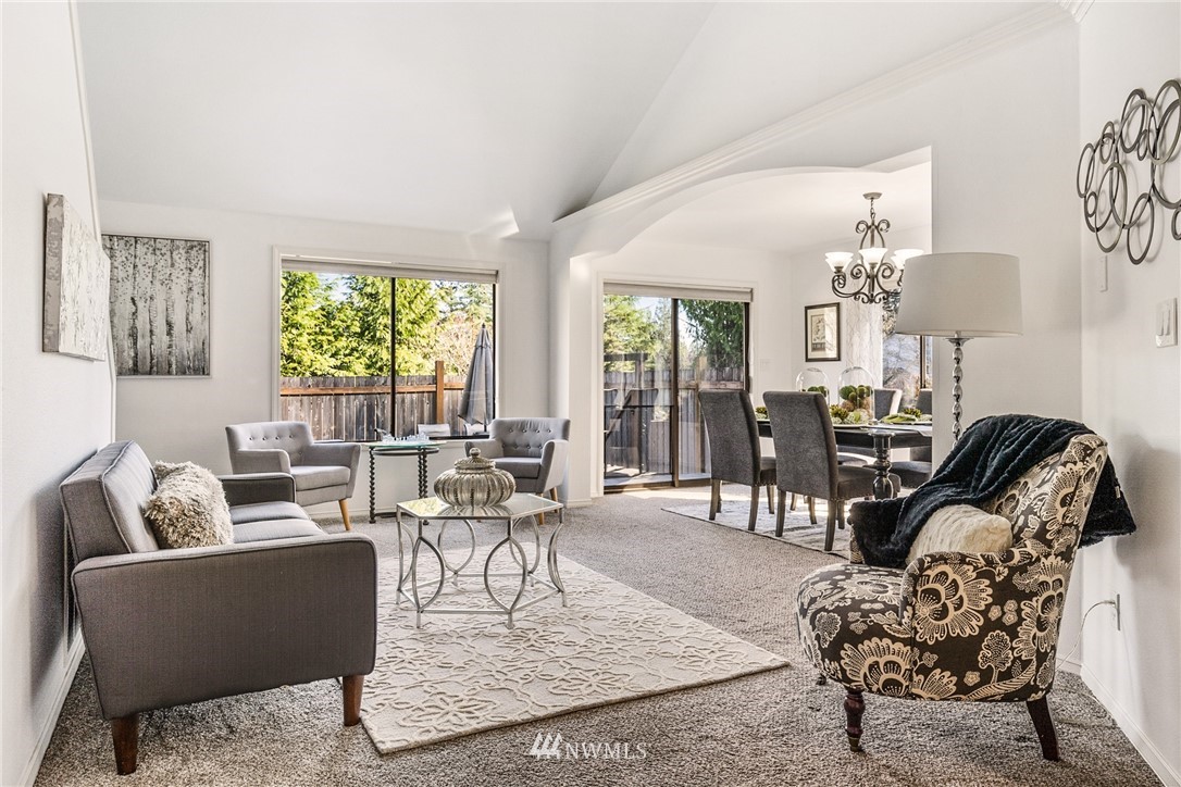 5405 156th Street Southwest Edmonds, WA 98026 - Photo 6 of 27 a living room with furniture couches and large windows
