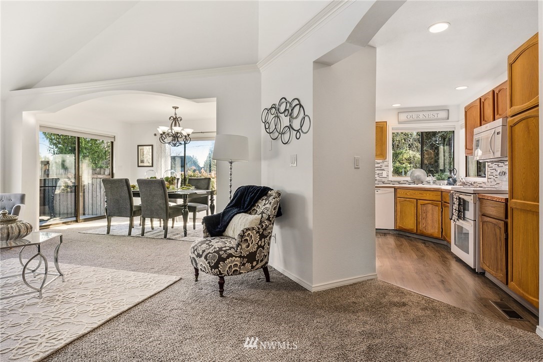 5405 156th Street Southwest Edmonds, WA 98026 - Photo 7 of 27 a living room with furniture a dining table and chairs