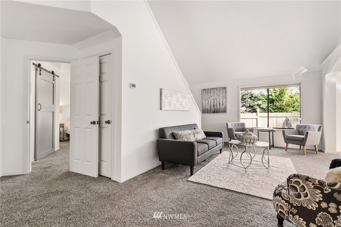 5405 156th Street Southwest Edmonds, WA 98026 - Photo 8 of 27 a living room with furniture and a large window