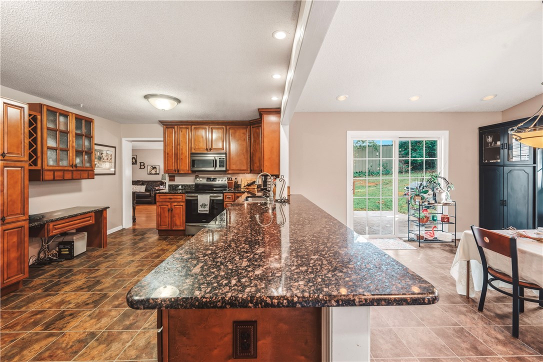 2001 Ridgeview Lane Seneca, SC 29678 - Photo 10 of 27 A well-equipped kitchen boasts generous counter space and seamless outdoor access.