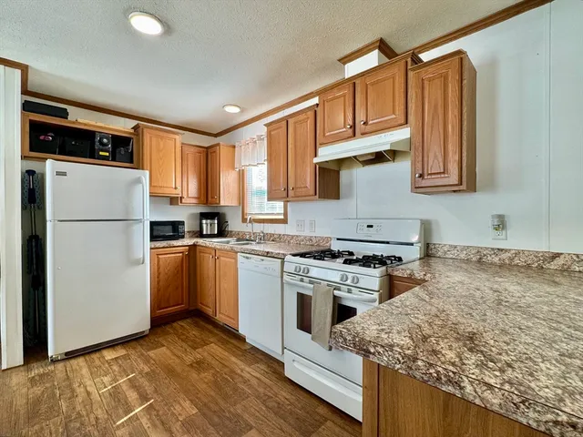 a kitchen with a refrigerator sink and stove