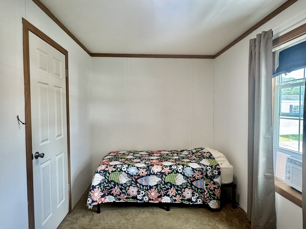 268 Palmer Road, Unit 2 Monson, MA 01057 - Photo 4 of 9 a bedroom with a bed and window