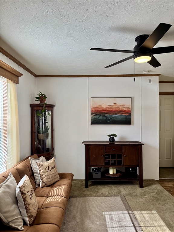 268 Palmer Road, Unit 2 Monson, MA 01057 - Photo 7 of 9 a living room with furniture and a flat screen tv