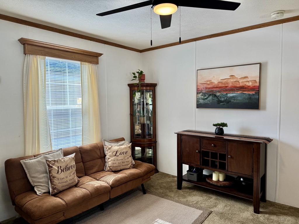 268 Palmer Road, Unit 2 Monson, MA 01057 - Photo 8 of 9 a living room with furniture and a flat screen tv