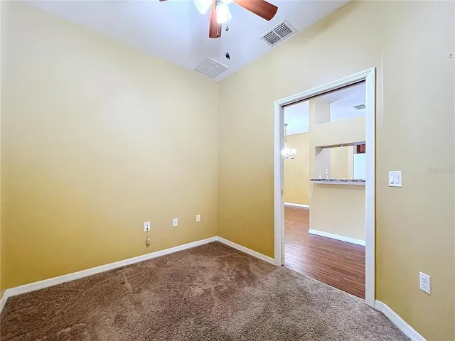 a view of a big room with windows