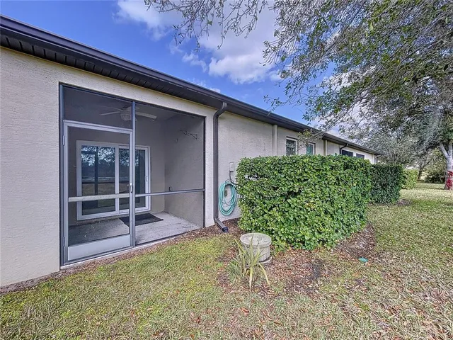 a view of a yard with cars parked
