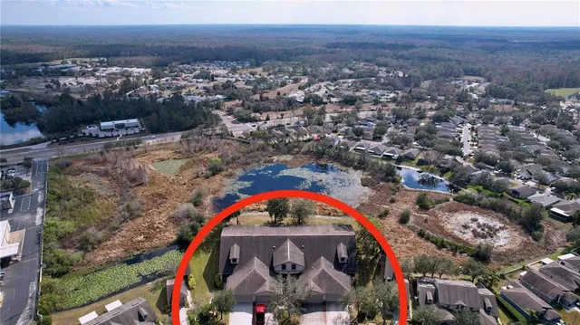 an aerial view of a house with a garden