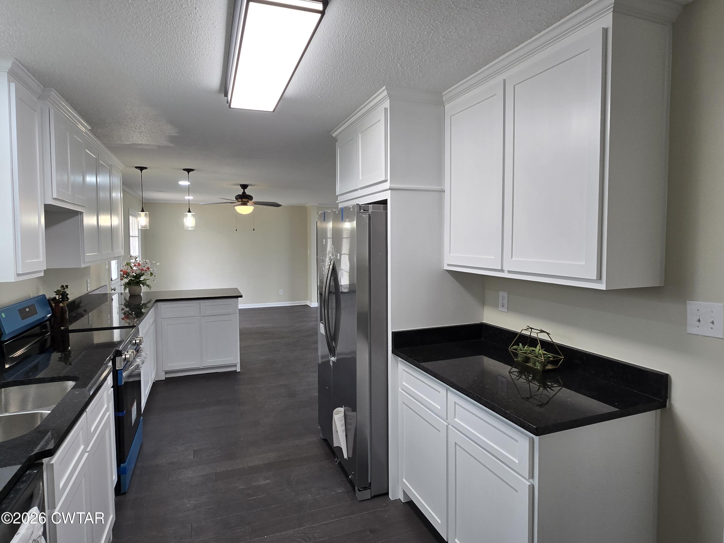 49 Brenda Lane Jackson, TN 38301 - Photo 11 of 23 a kitchen with a sink stove and refrigerator