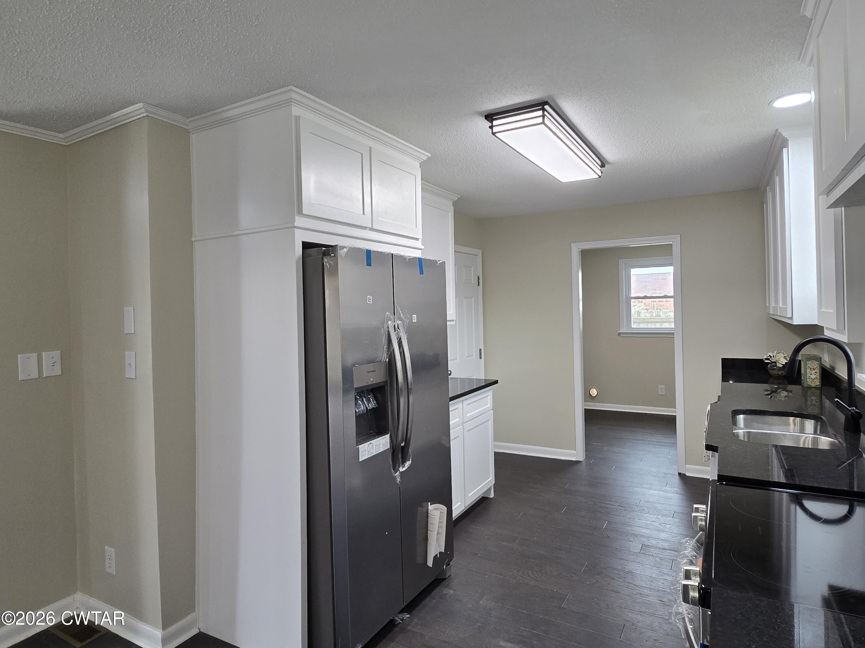 49 Brenda Lane Jackson, TN 38301 - Photo 12 of 23 a kitchen with stainless steel appliances a refrigerator and a sink
