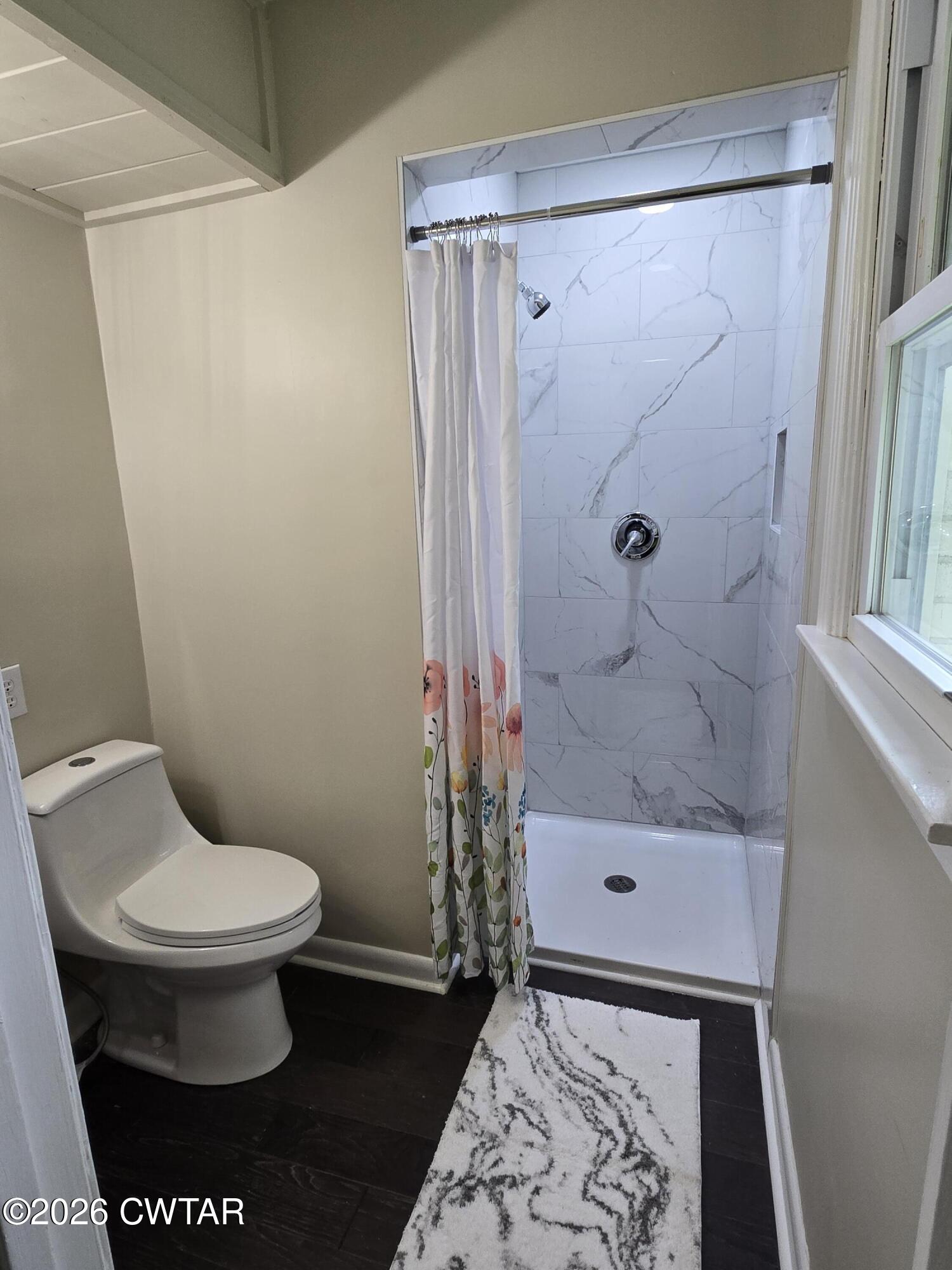 49 Brenda Lane Jackson, TN 38301 - Photo 15 of 23 a bathroom with a toilet and a shower