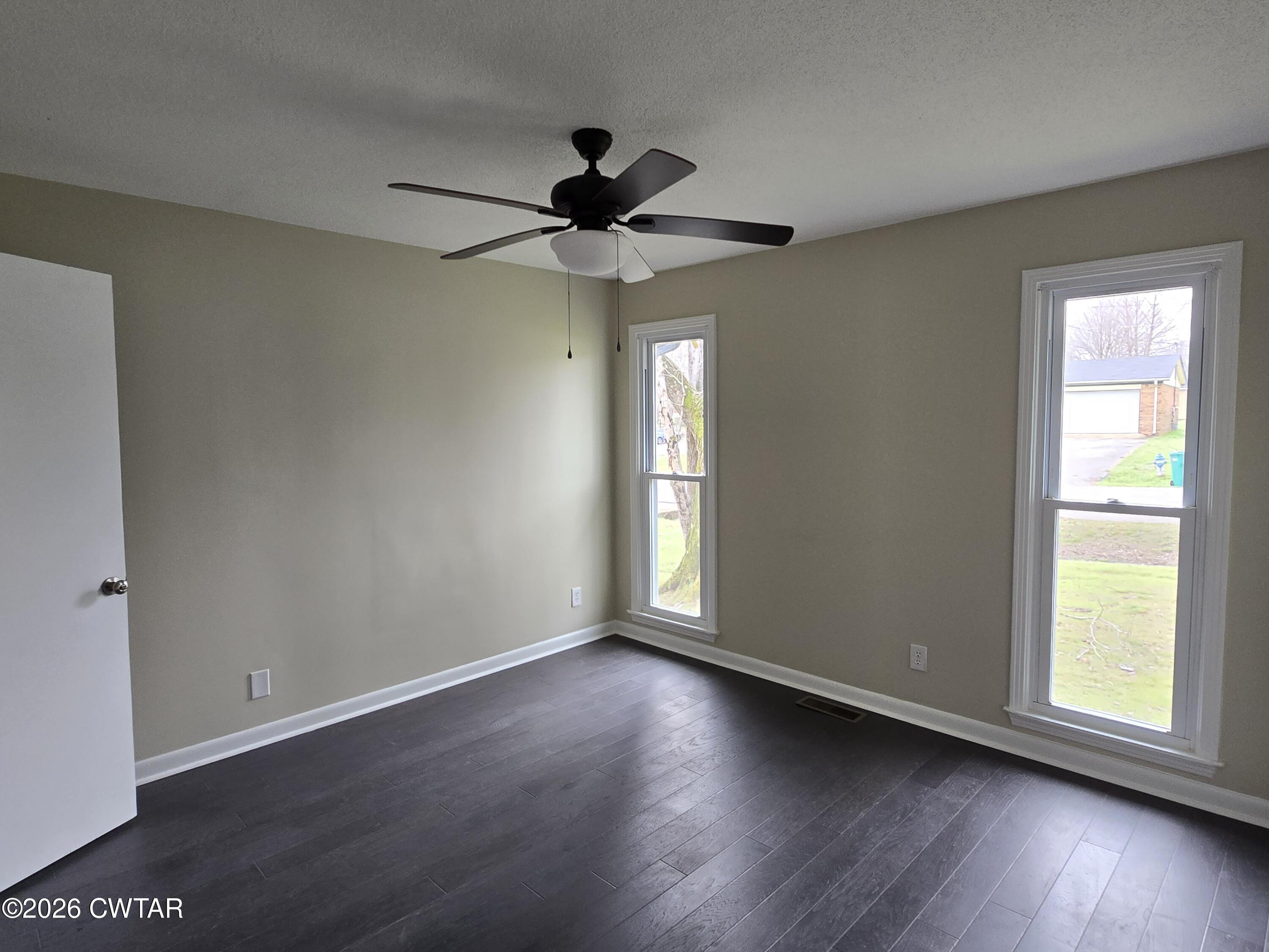49 Brenda Lane Jackson, TN 38301 - Photo 17 of 23 a view of an empty room with wooden floor and a window