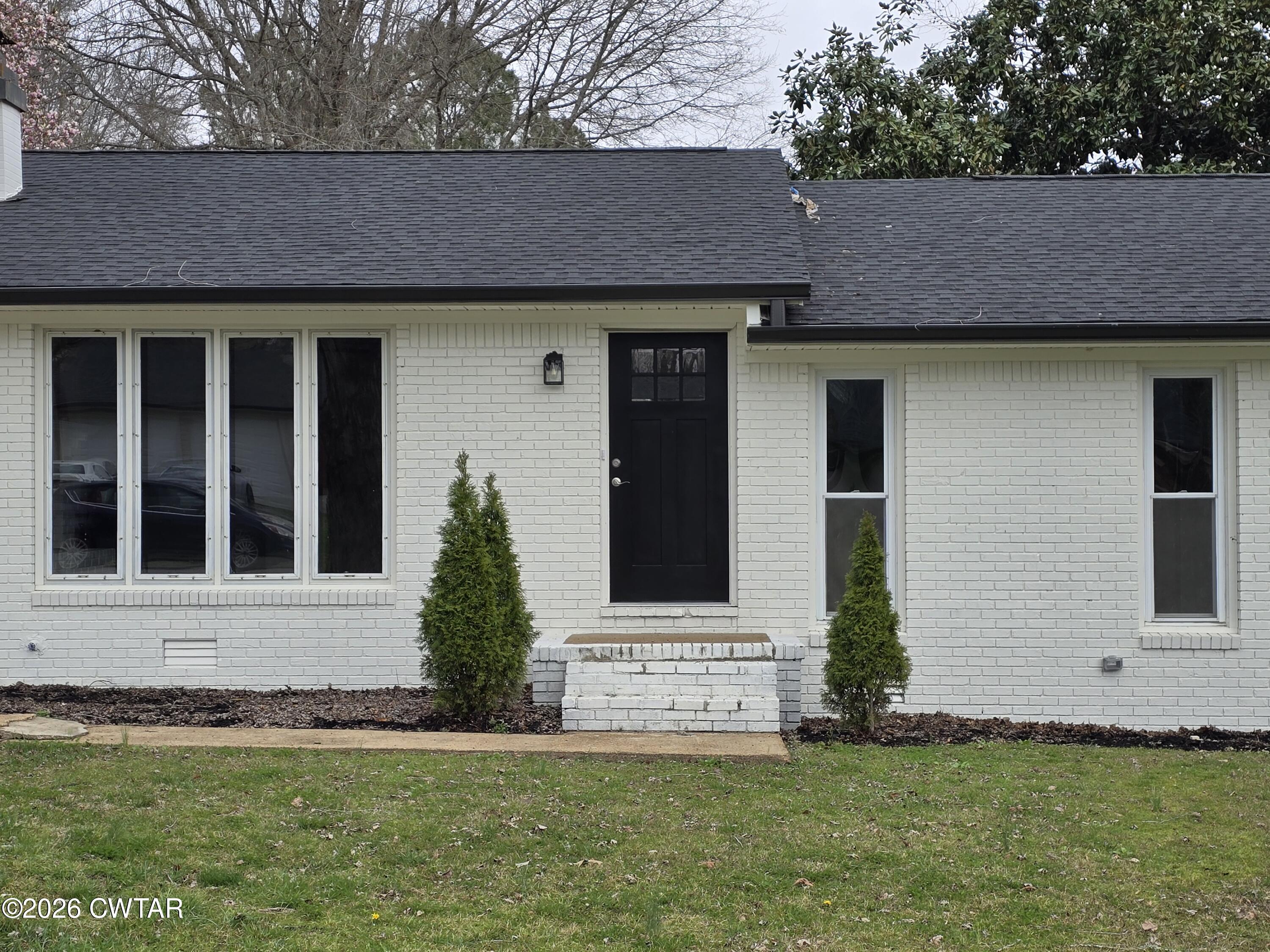 49 Brenda Lane Jackson, TN 38301 - Photo 2 of 23 a view of a house with a yard