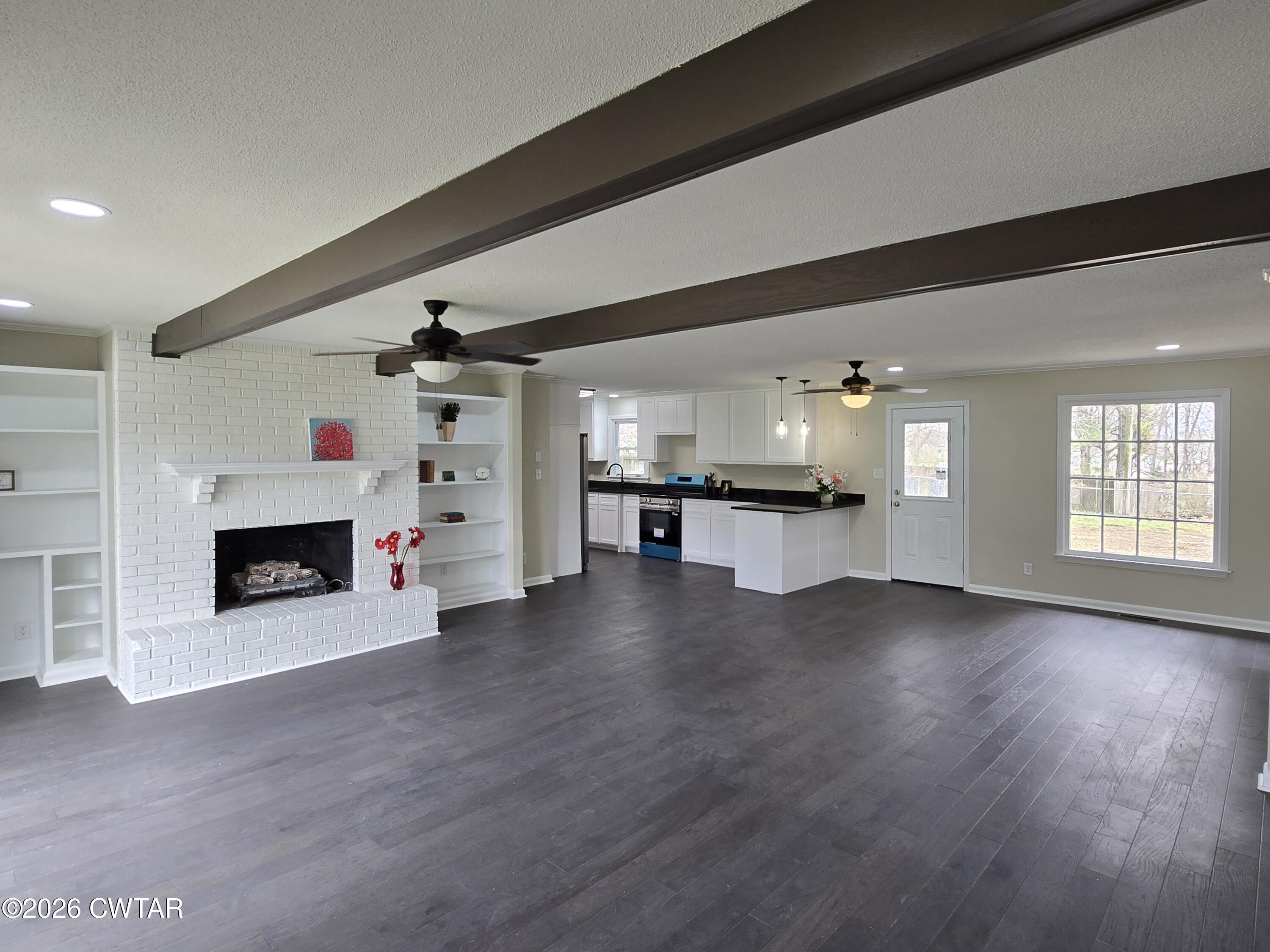 49 Brenda Lane Jackson, TN 38301 - Photo 5 of 23 a view of an empty room with a fireplace and a window